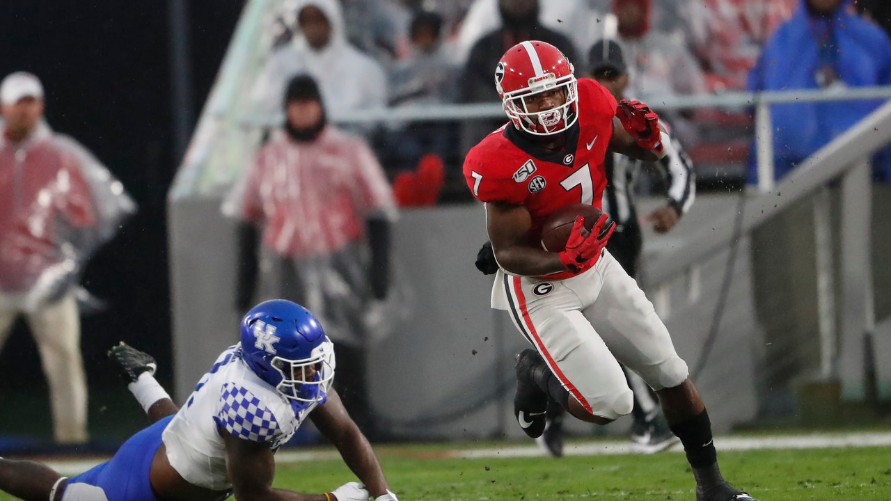 Swift runs for 2 TDs as No. 10 Georgia tops Kentucky 21-0